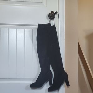 Knee high black high heeled boots